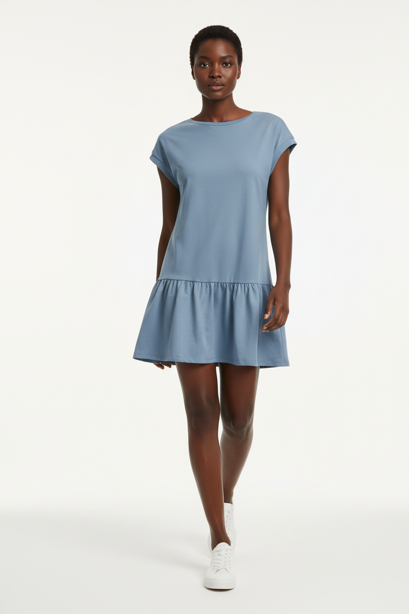 Robe t-shirt mini col rond à manches cap en bleu français en mouvement sur fond blanc studio - pose dynamique révélant la légèreté et le mouvement gracieux du volant bas - Style casual chic en action - Collection premium Black-Coat