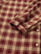 Vue latérale de la robe chemise mini à motif tartan - angle soulignant la coupe flatteuse, les manches longues élégantes et l'ourlet volants pour un look sophistiqué accessible
