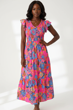  Mannequin portant la Robe Bohème Imprimé Floral Black-Coat rose vif et multicolore - vue de face montrant le décolleté en V, les manches volantées et la taille smockée