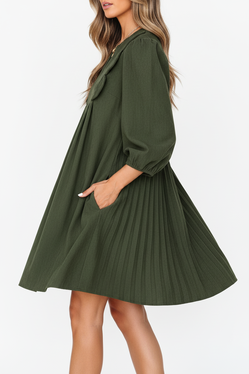 Robe mini velours côtelé plissé vert mousse manches bracelet détails festonnés - vue de profil latéral montrant la silhouette élégante, plis structurés créant du mouvement, manches bracelet visibles, coupe flatteuse vintage moderne - BLACK-COAT